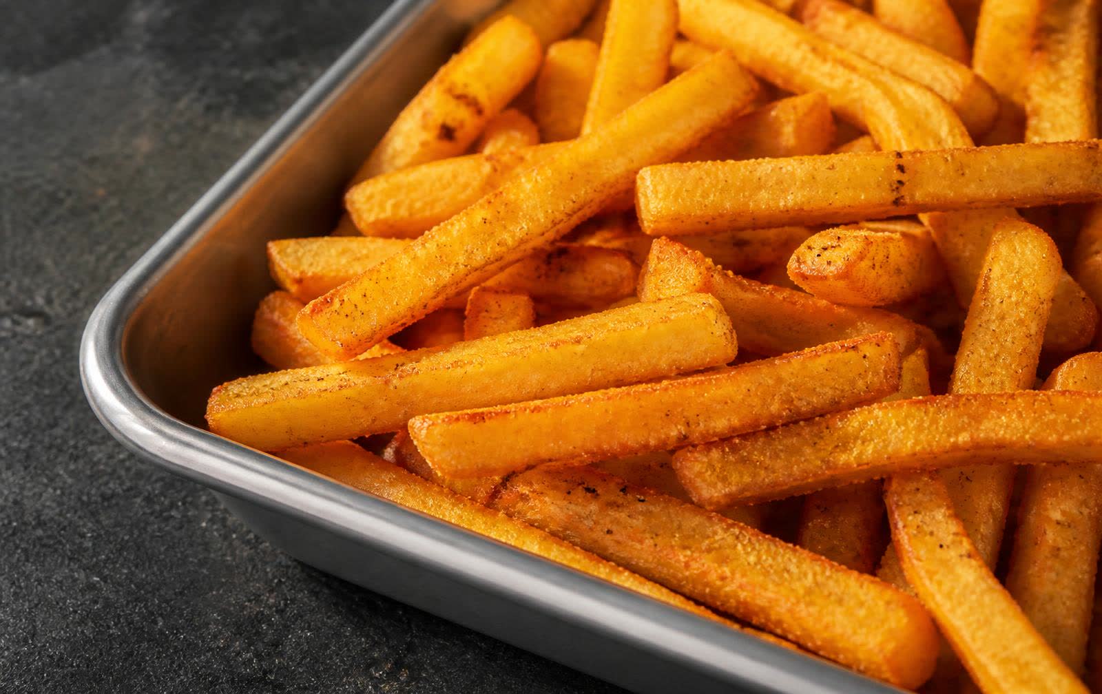 Seasoned coated potato fries developed during customer coating trials