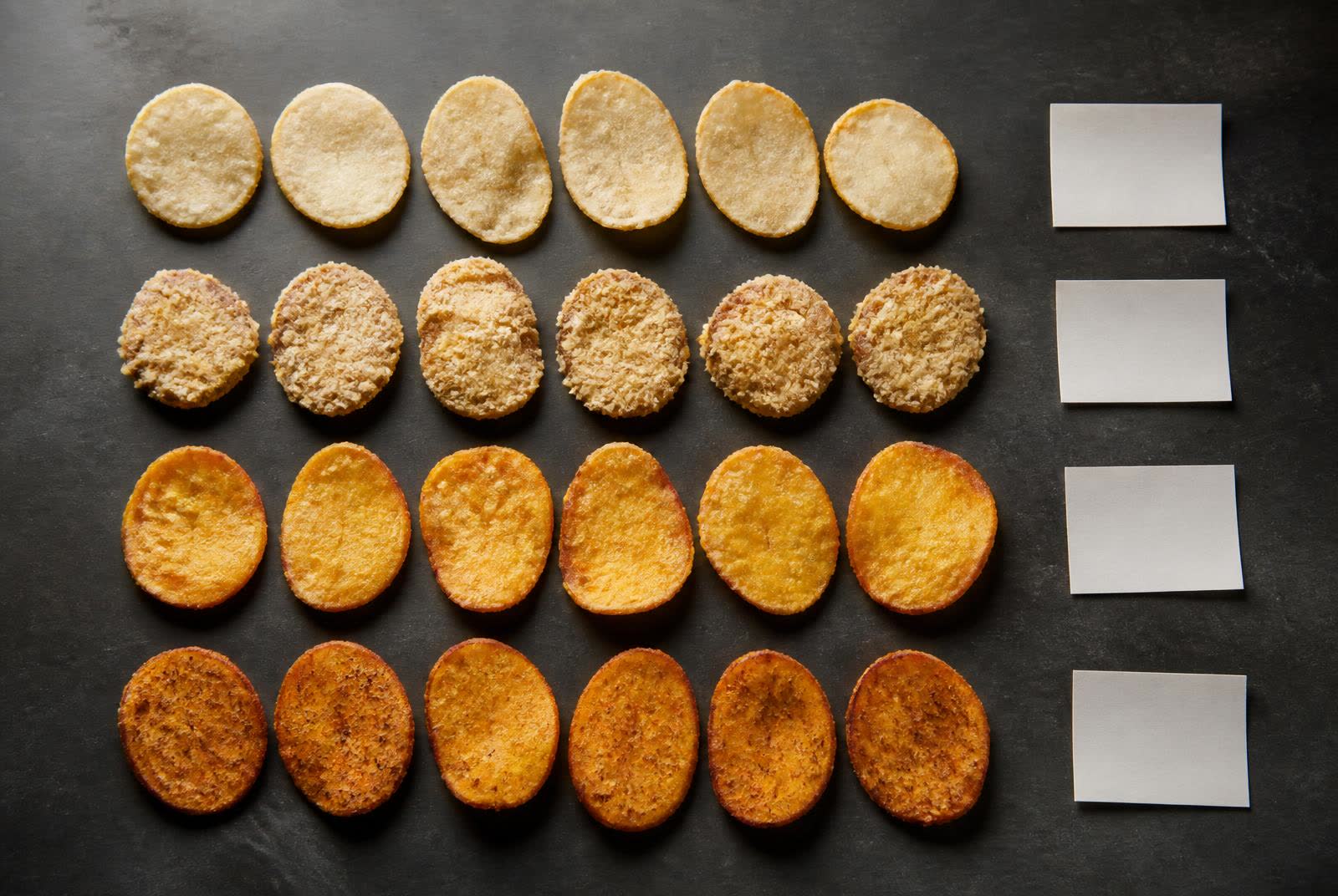 Development comparison of coated potato and sweet potato pieces showing different coating coverage, texture and colour
